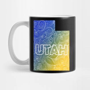 Colorful mandala art map of Utah with text in blue and yellow Mug